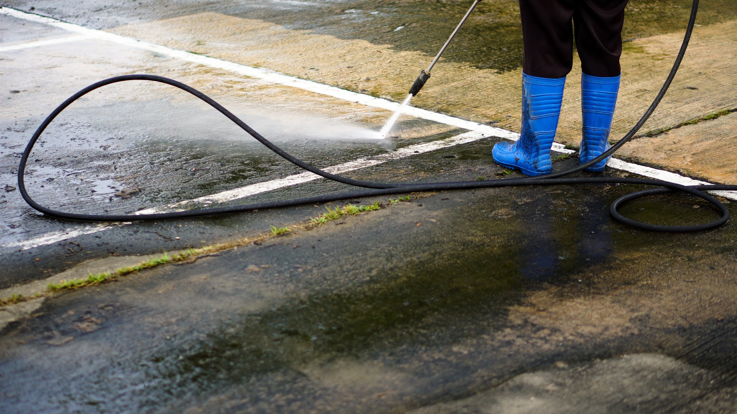 Professional pressure washing service cleaning industrial exterior surface